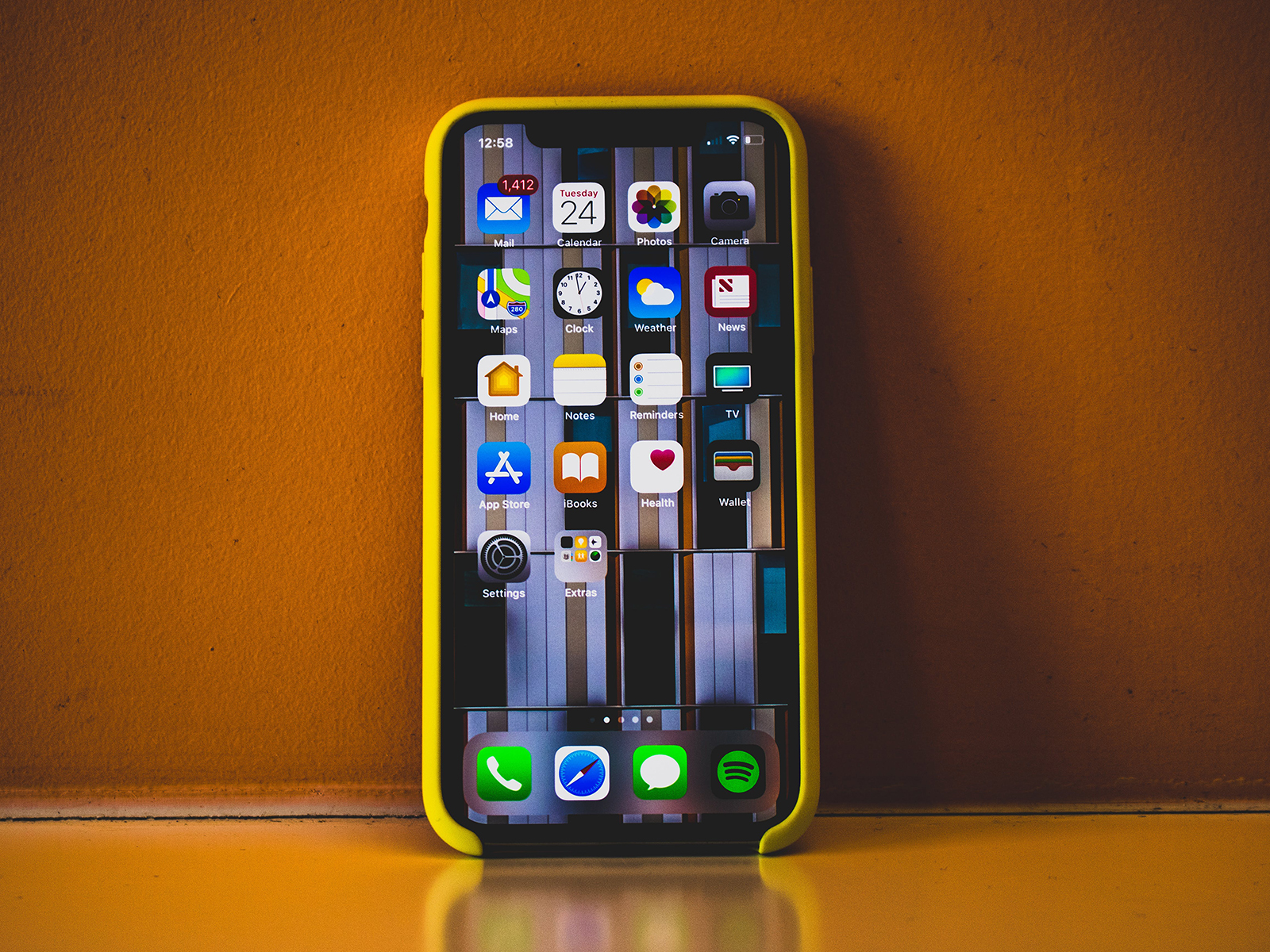 KinseyInvestigations.com Cell Phone Forensics - A cell phone is pictured standing against an amber background.