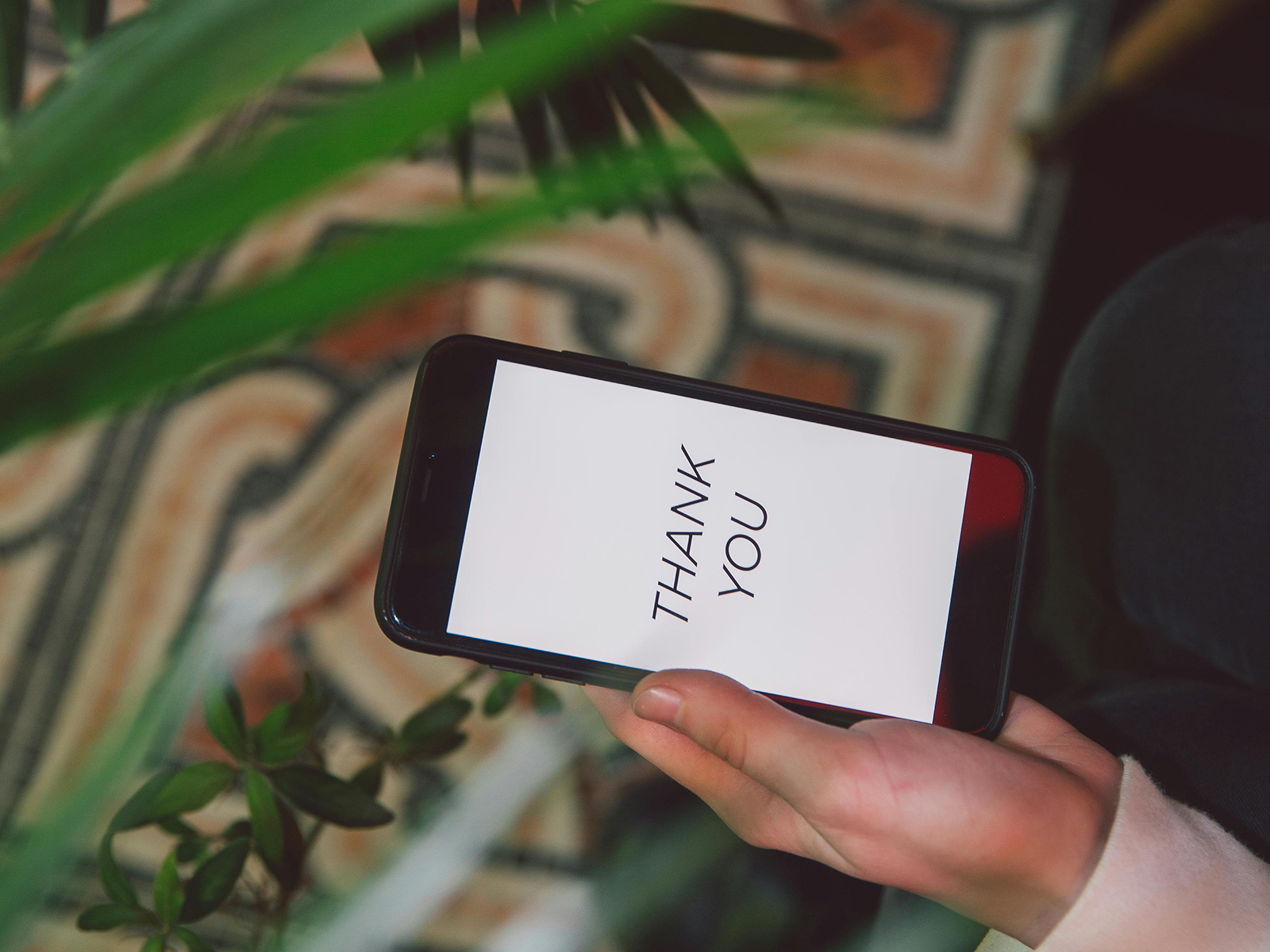 KinseyInvestigations.com How much does a private investigator cost? - A cell phone displays the words thank you.