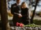 KinseyInvestigations.com Wrongful Death Investigations - A man and woman hold hands while looking at a grave stone.