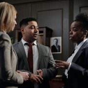 KinseyInvestigations.com Civil Litigation Support - Three professionals appear engaged in conversation.