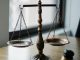 KinseyInvestigations.com Civil Litigation Support - Metal scales sit on a law office desk.