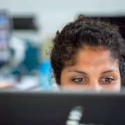 Female investigator at computer - Contact Kinsey Investigations.