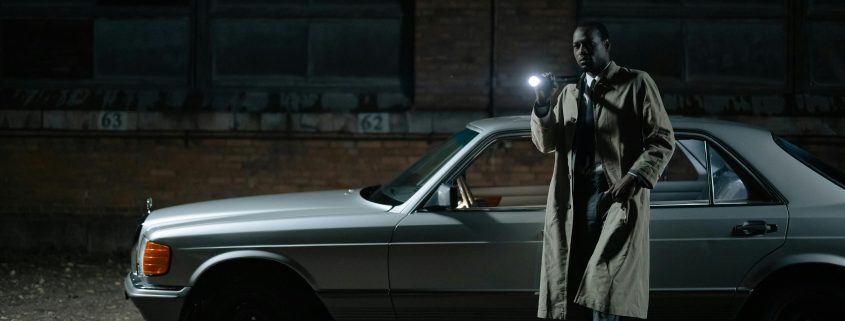 Investigator with flashlight - Contact Kinsey Investigations.